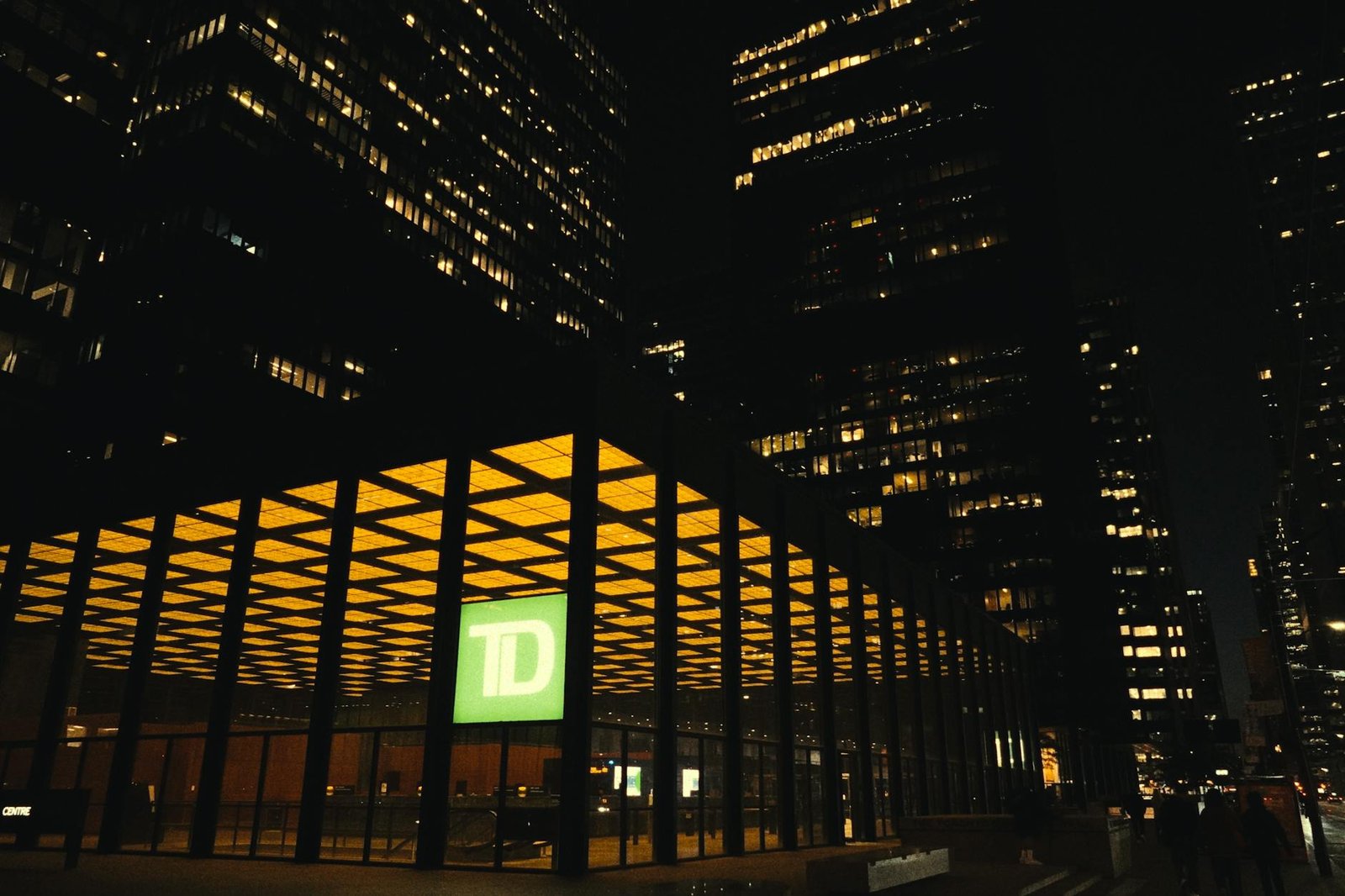 Dramatic nighttime view of Toronto's TD Centre illuminated against the city skyline.
